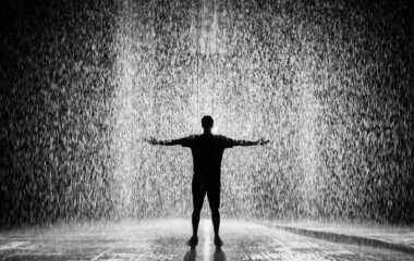 silhouette of man in rain black and white