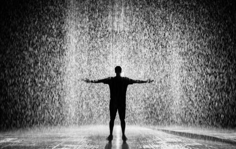 silhouette of man in rain black and white